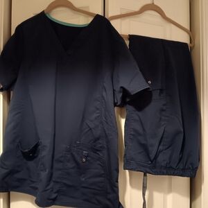 Navy scrub set xl,shirt has faint bleach as pointed to n 4th photo ,pants great